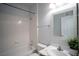 Bright bathroom featuring a shower-tub combo and a white marble countertop at 8555 W Russell Rd # 2020, Las Vegas, NV 89113