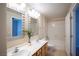Bathroom featuring double sinks, vanity, decorative mirrors, and a bathtub at 8555 W Russell Rd # 2020, Las Vegas, NV 89113