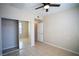 Bright bedroom features tile floors and mirrored closet doors for a spacious feel at 8555 W Russell Rd # 2020, Las Vegas, NV 89113
