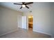 Neutral bedroom with tiled flooring, ceiling fan, and view into the attached bathroom and adjacent room at 8555 W Russell Rd # 2020, Las Vegas, NV 89113
