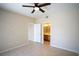 Bedroom featuring tile floor, neutral paint, ceiling fan and access to attached bathroom at 8555 W Russell Rd # 2020, Las Vegas, NV 89113