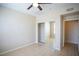 Bright bedroom features tile floors and mirrored closet doors providing a spacious feel at 8555 W Russell Rd # 2020, Las Vegas, NV 89113