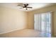 Bright bedroom featuring tiled floors and a ceiling fan at 8555 W Russell Rd # 2020, Las Vegas, NV 89113