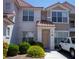 Charming two-story townhome with well-maintained landscaping and a welcoming front entrance at 8555 W Russell Rd # 2020, Las Vegas, NV 89113
