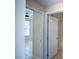 Hallway featuring an open bedroom doorway and a doorway to an attached bathroom at 8555 W Russell Rd # 2020, Las Vegas, NV 89113