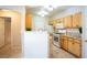 Open kitchen featuring a breakfast bar, granite countertops, and appliances at 8555 W Russell Rd # 2020, Las Vegas, NV 89113