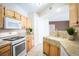Spacious kitchen with granite countertops, stainless steel appliances, and ample cabinet space at 8555 W Russell Rd # 2020, Las Vegas, NV 89113