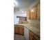 Kitchen features wooden cabinets, granite countertops, and stainless steel appliances at 8555 W Russell Rd # 2020, Las Vegas, NV 89113