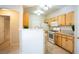 Open kitchen with granite countertops, bar seating, and view of the breakfast nook at 8555 W Russell Rd # 2020, Las Vegas, NV 89113