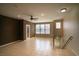 Spacious living room with tile flooring, ceiling fan, and ample natural light from large windows at 8555 W Russell Rd # 2020, Las Vegas, NV 89113