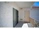 Enclosed patio includes a sliding glass door, door to storage, and a metal railing at 8555 W Russell Rd # 2020, Las Vegas, NV 89113