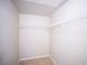 Empty walk-in closet with built in wire shelving and tile flooring at 8555 W Russell Rd # 2020, Las Vegas, NV 89113