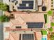 Aerial view of a house with solar panels, artificial turf, and an outdoor trampoline in a well-maintained backyard at 8836 Martin Downs Pl, Las Vegas, NV 89131