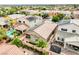 Aerial view showcasing a home with a pool, covered patio, and well-maintained backyard, enhanced by desert landscaping at 8836 Martin Downs Pl, Las Vegas, NV 89131