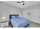 Comfortable bedroom featuring a ceiling fan, and sliding closet doors at 8836 Martin Downs Pl, Las Vegas, NV 89131