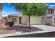Charming single-story home with a two-car garage, xeriscaped yard, and well-maintained exterior at 8836 Martin Downs Pl, Las Vegas, NV 89131