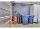 This garage features an air compressor, water softener system, and trash bins at 8836 Martin Downs Pl, Las Vegas, NV 89131