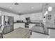 Bright kitchen featuring granite countertops, stainless steel appliances, and ample cabinet space at 8836 Martin Downs Pl, Las Vegas, NV 89131