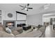 Cozy living room with fireplace, large screen, and comfortable sectional seating at 8836 Martin Downs Pl, Las Vegas, NV 89131