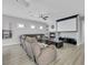 Inviting living room with a projector screen, fireplace, and comfortable reclining sofa at 8836 Martin Downs Pl, Las Vegas, NV 89131