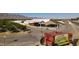 Wide view of Gilcrease Orchard, showcasing fruit trees, barn structures, and open-air seating area at 8836 Martin Downs Pl, Las Vegas, NV 89131