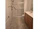 Accessible bathroom with a step-in shower, grab bars, and updated vanity at 8985 S Durango Dr # 1154, Las Vegas, NV 89113