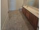 Bathroom with a double sink vanity, linen closet, and ceramic tile floors at 8985 S Durango Dr # 1154, Las Vegas, NV 89113