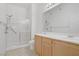 Bathroom showcasing a double sink vanity and glass-enclosed shower at 8985 S Durango Dr # 1154, Las Vegas, NV 89113
