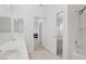 Bathroom with shower, sink, and view of the fireplace in the other room at 8985 S Durango Dr # 1154, Las Vegas, NV 89113