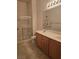 Bright bathroom featuring a walk-in shower and a double sink vanity at 8985 S Durango Dr # 1154, Las Vegas, NV 89113