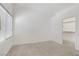 Bright bedroom with neutral carpeting, a window with blinds, and walk-in closet at 8985 S Durango Dr # 1154, Las Vegas, NV 89113