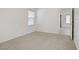 Bright bedroom with neutral carpet and an entrance to another room at 8985 S Durango Dr # 1154, Las Vegas, NV 89113