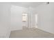 A carpeted bedroom with a closet and entry door to the adjacent bathroom at 8985 S Durango Dr # 1154, Las Vegas, NV 89113