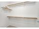 A walk-in closet with wood shelving and carpeted floors provides storage at 8985 S Durango Dr # 1154, Las Vegas, NV 89113