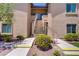 Building entrance with stairs, showcasing clean landscaping and well-maintained exterior at 8985 S Durango Dr # 1154, Las Vegas, NV 89113
