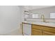 Bright kitchen with a sink, dishwasher, and view of other living areas at 8985 S Durango Dr # 1154, Las Vegas, NV 89113