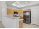 Bright kitchen featuring stainless steel appliances and breakfast bar at 8985 S Durango Dr # 1154, Las Vegas, NV 89113