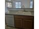 Kitchen featuring white dishwasher and cabinets, and stainless steel faucet at 8985 S Durango Dr # 1154, Las Vegas, NV 89113