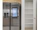 Kitchen refrigerator and shelving inside pantry, providing ample storage at 8985 S Durango Dr # 1154, Las Vegas, NV 89113