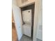 Efficient stacked washer and dryer unit inside of a closet with shelving at 8985 S Durango Dr # 1154, Las Vegas, NV 89113