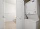 A stacked washer and dryer are conveniently located near the bathroom at 8985 S Durango Dr # 1154, Las Vegas, NV 89113