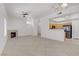 Open-concept living space with tile flooring, fireplace, and adjacent kitchen at 8985 S Durango Dr # 1154, Las Vegas, NV 89113