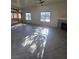 Bright living room featuring tile floors, large windows, and a cozy fireplace, perfect for comfortable living at 8985 S Durango Dr # 1154, Las Vegas, NV 89113