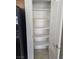 A white pantry with shelving for storage at 8985 S Durango Dr # 1154, Las Vegas, NV 89113