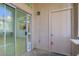This patio features a sliding glass door, a storage closet, and an exterior light fixture at 8985 S Durango Dr # 1154, Las Vegas, NV 89113