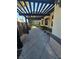 Charming patio with a pergola, seating and manicured landscaping at 8985 S Durango Dr # 1154, Las Vegas, NV 89113