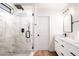 Modern bathroom featuring a glass shower, sleek vanity with dual sinks, and updated fixtures at 1011 Pearl Marble Ave, North Las Vegas, NV 89081