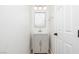 Stylish half bath with a modern vanity, granite countertop, and elegant light fixture at 1011 Pearl Marble Ave, North Las Vegas, NV 89081