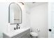 Bathroom featuring a decorative mirror, grey vanity and black hardware at 1011 Pearl Marble Ave, North Las Vegas, NV 89081