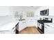 Modern kitchen featuring white cabinets, stainless steel appliances, and stylish countertops at 1011 Pearl Marble Ave, North Las Vegas, NV 89081